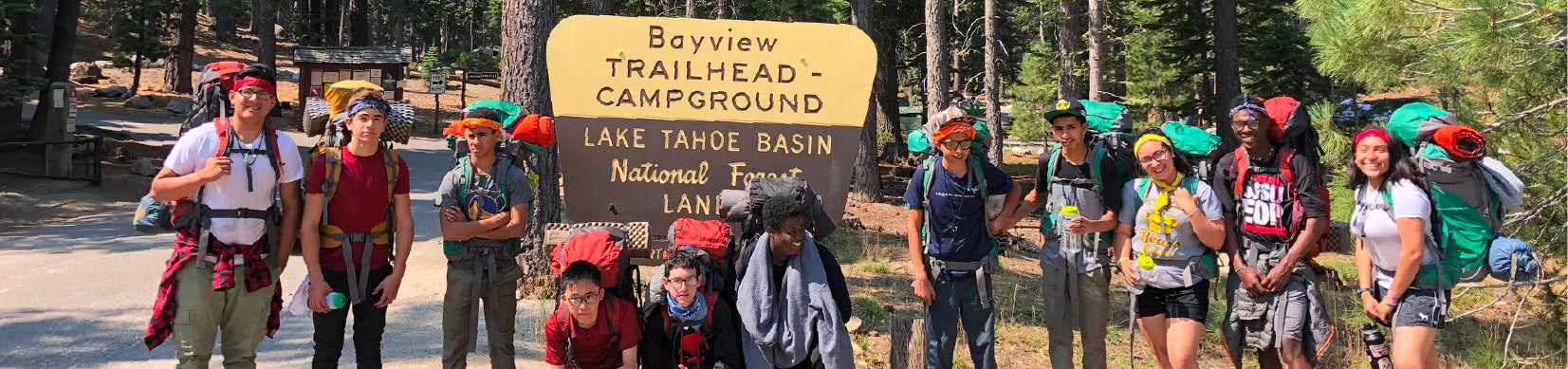 YMCA kids posed for a group picture in front of Bayview Campground trailhead sign