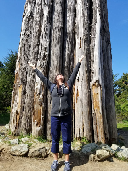 Woman in front of wooden spire