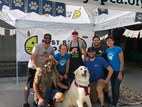 ASPCA with staffers and a dog