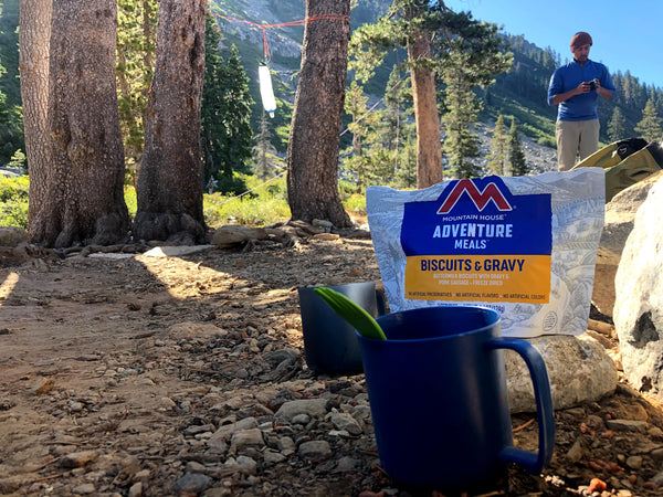 Picture of Adventure Meals Biscuits and Gravy with a cup in the foreground.