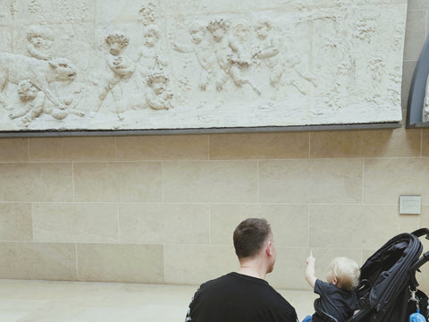 A toddler and his dad at the Louvre in Paris France