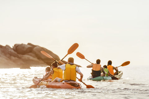 family kayaking on their overseas holidays