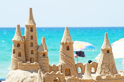 Very elaborate sand castle with several towers
