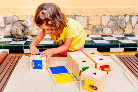 Girl playing with wooden Montessori toys in Australia