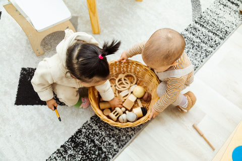 Children playing with educational wooden toys