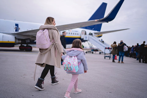 Mother boarding the plane with her daughter