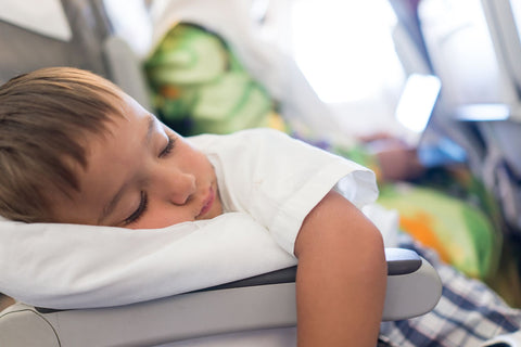 Toddler sleeping on plane