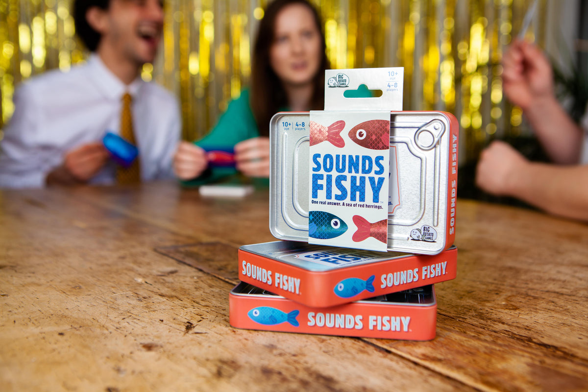 Sounds Fishy Travel box with people laughing in background