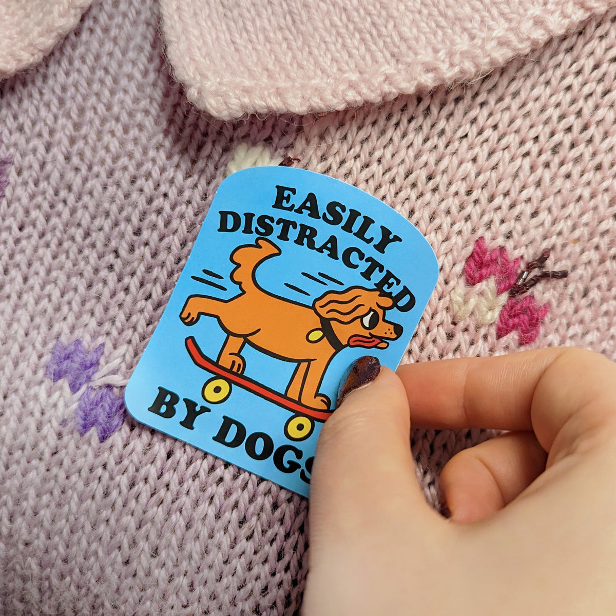 'Easily Distracted' sticker on jumper