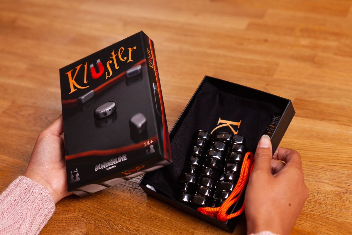 Hands opening Kluster box