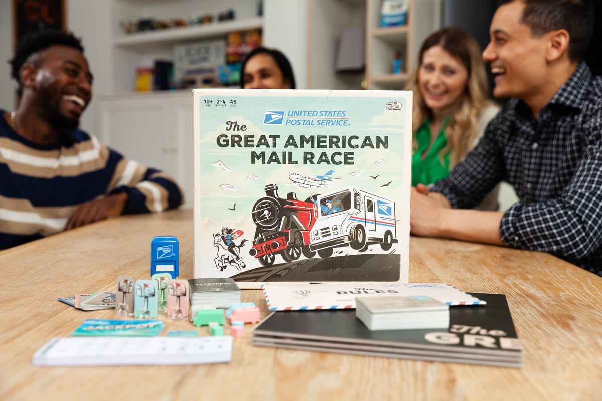 The Great American Mail Race box with people laughing in background