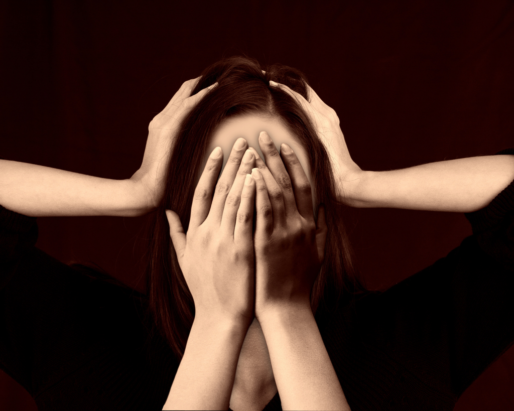 Woman feeling stressed about her hair loss