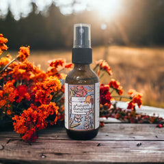 Autumn Sunshine Fragrance Spray on a wooden tabel with autumn flowers in a field