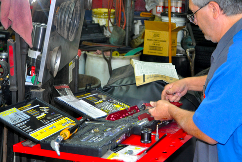 mechanic working with promaxx tool kits in the shop