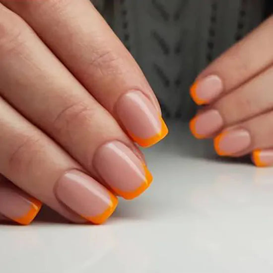 pomarańczowy manicure francuski lakiery hybrydowe pod