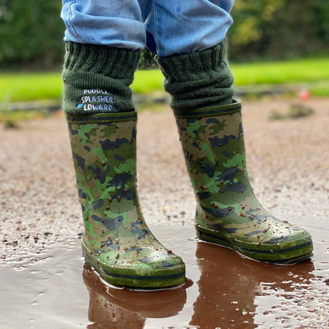 Child wearing Solesmith welly socks inside welly boots