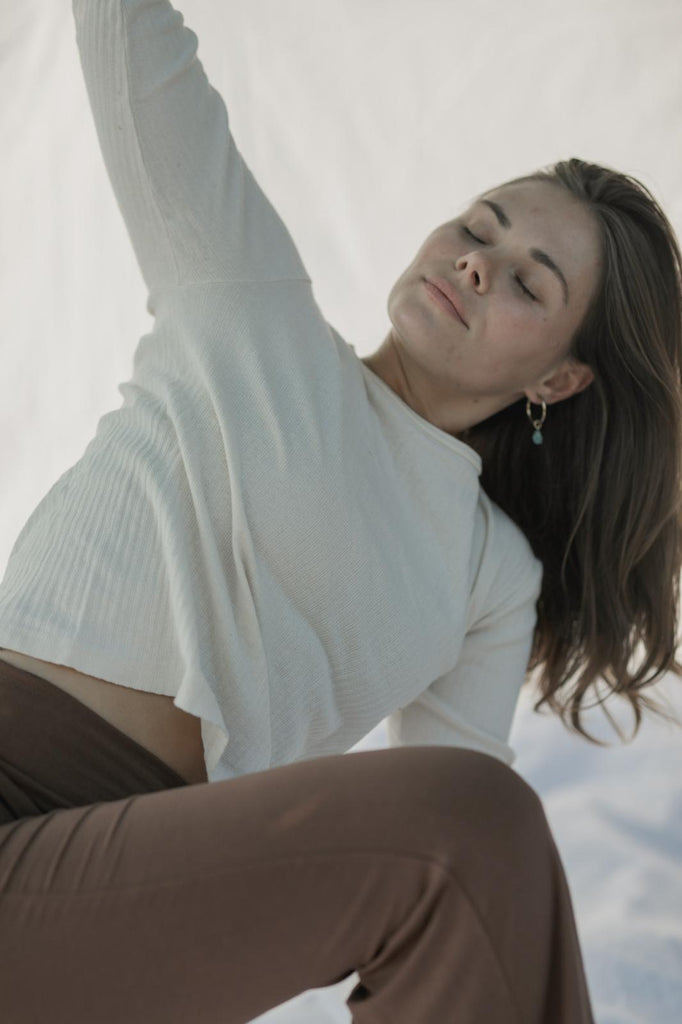 A girl is doing a yoga asana