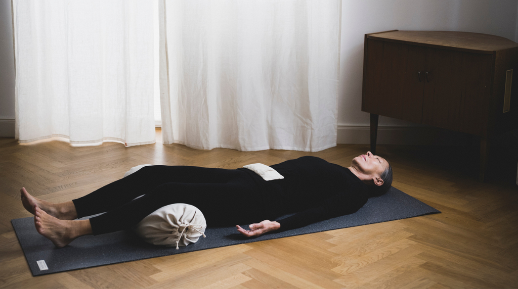 The grape seed pillow lies warmed up on your stomach