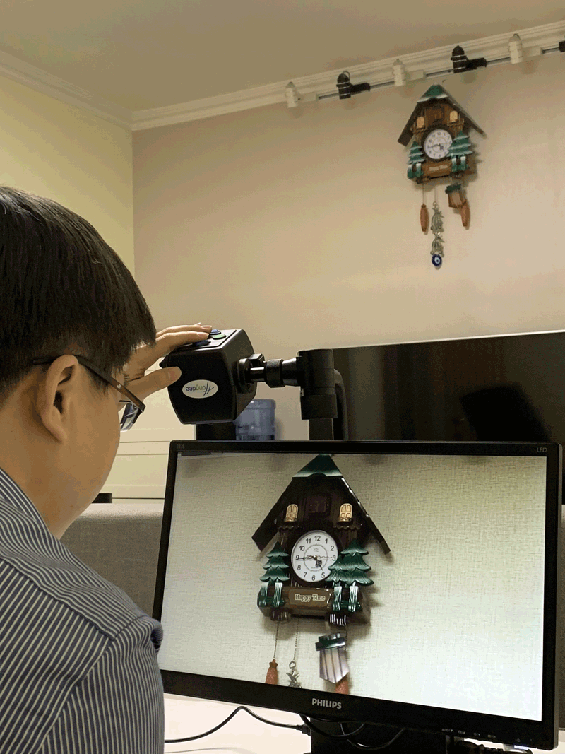 digimax man viewing clock on wall