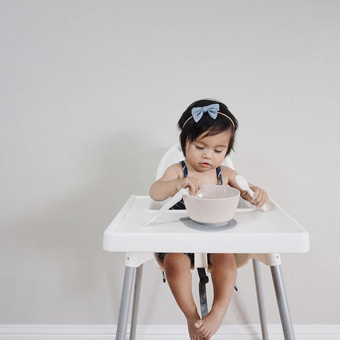 Weaning baby girl eating