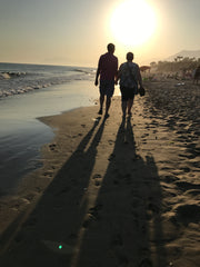 Walking on the beach at sunset