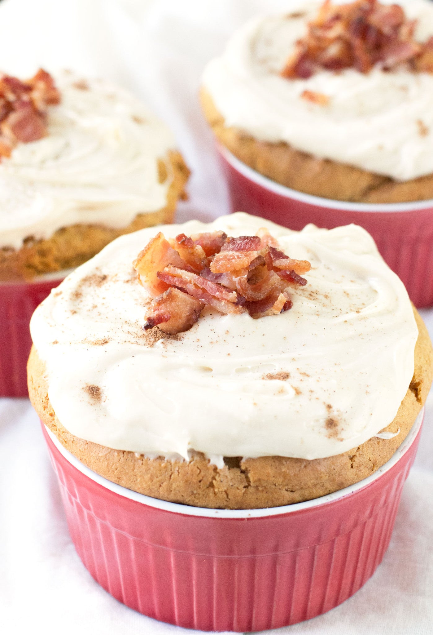 Individual Pumpkin Spice Cakes with Cream Cheese Frosting and Candied Bacon | Sauce + Style