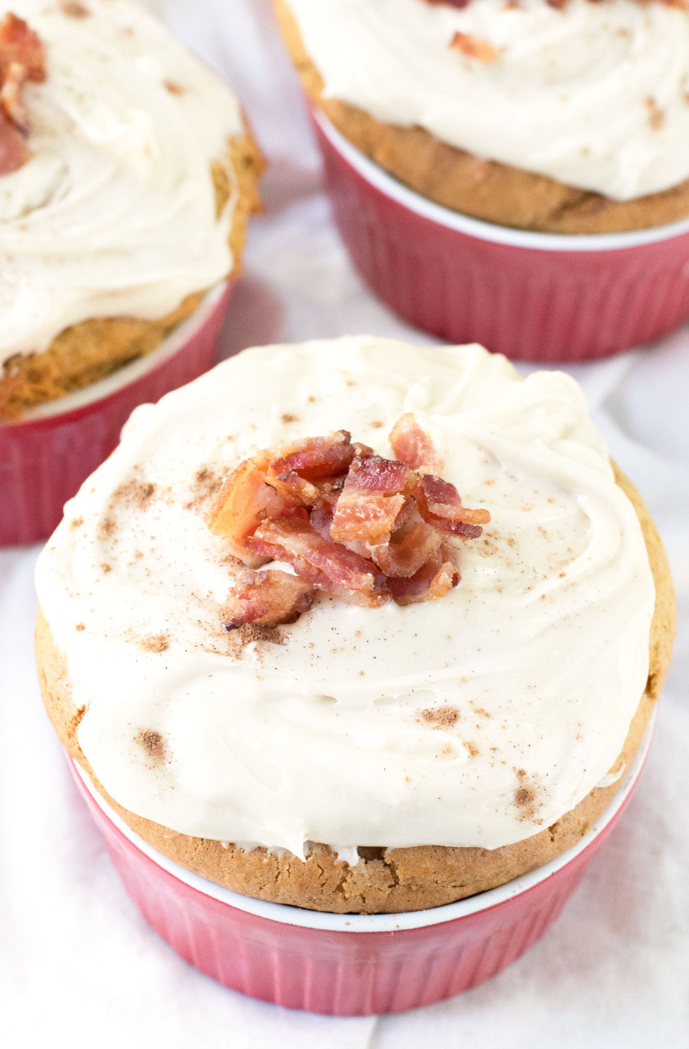 Individual Pumpkin Spice Cakes with Cream Cheese Frosting and Candied Bacon | Sauce + Style