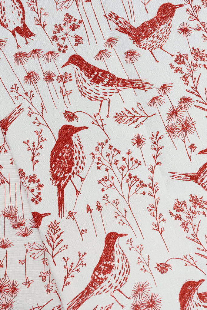 Screen printed fabric with red brown thrashers