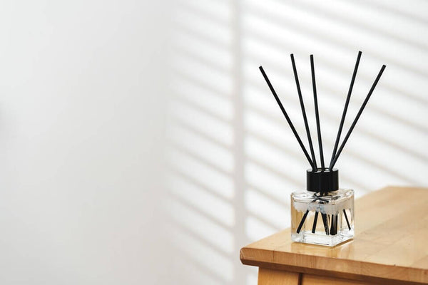 A diffuser placed on a wooden table