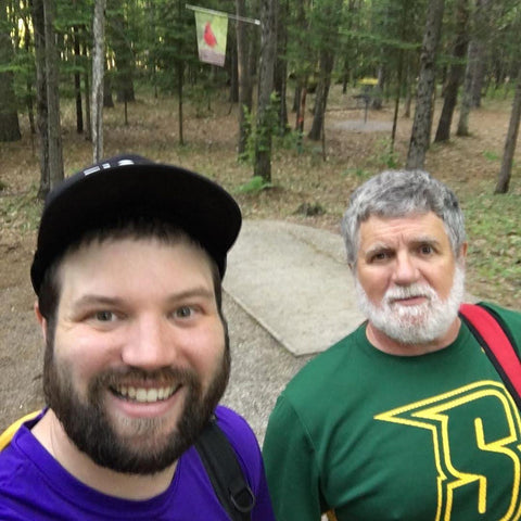 andrew & michael streeter playing disc golf together