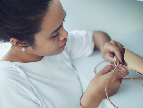 Kamaro'an artisan weaving leather