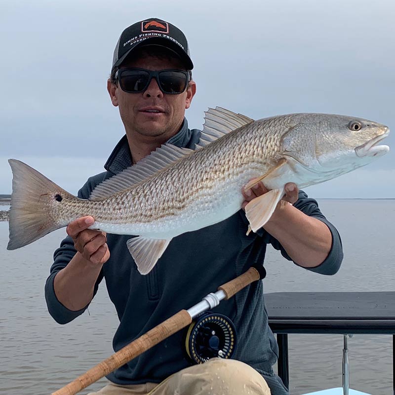 Captain Tuck Scott with a nice redfish caught this week