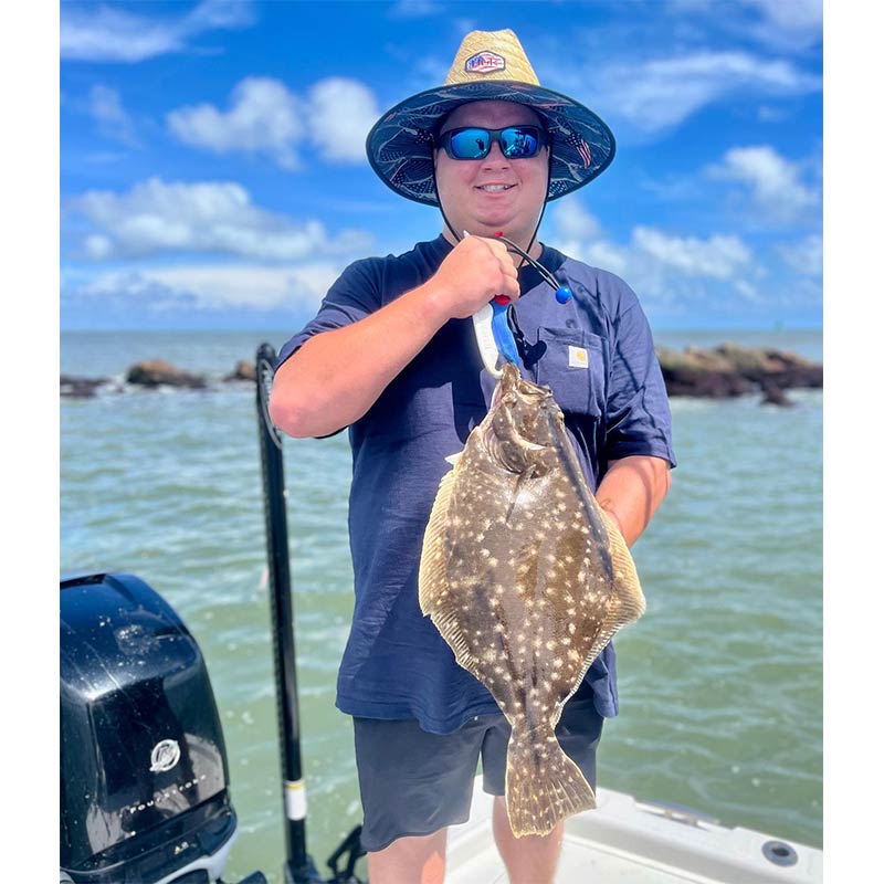 A nice jetty flounder caught with Redfin Charters