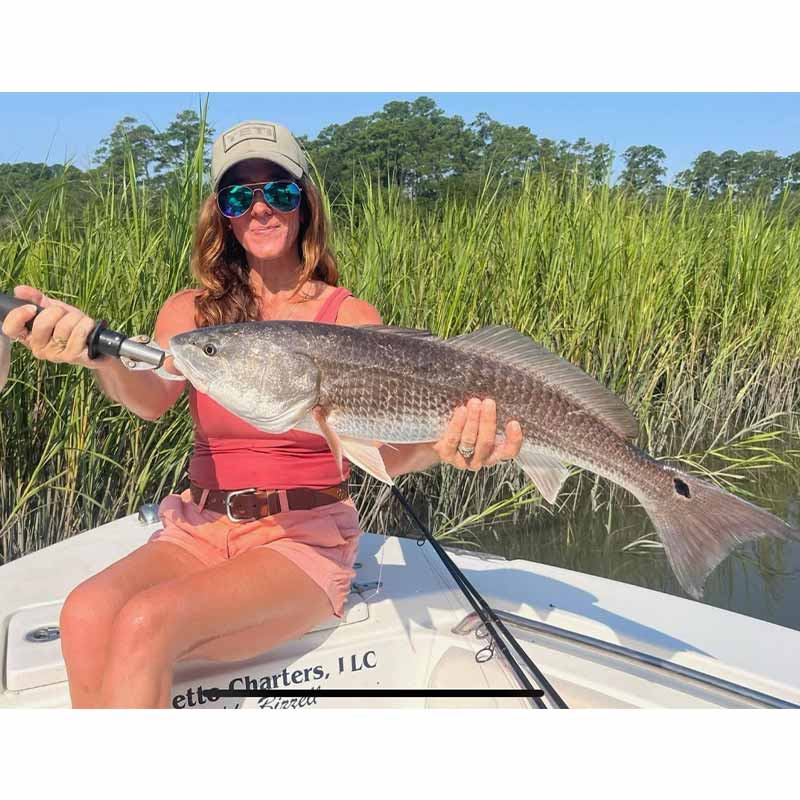 Angela Smith with her PR red drum caught with Captain Buddy Bizzell