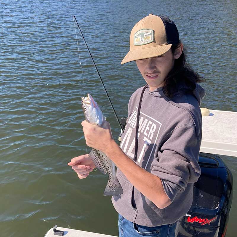 Kai's cousin Grayson Hartson of Marion may have caught this trout on mud minnow, but it's the mullet that did it