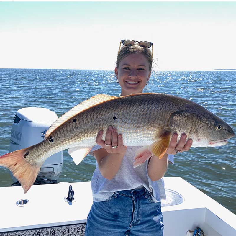 A bull red on Captain Kai's boat always produces smiles
