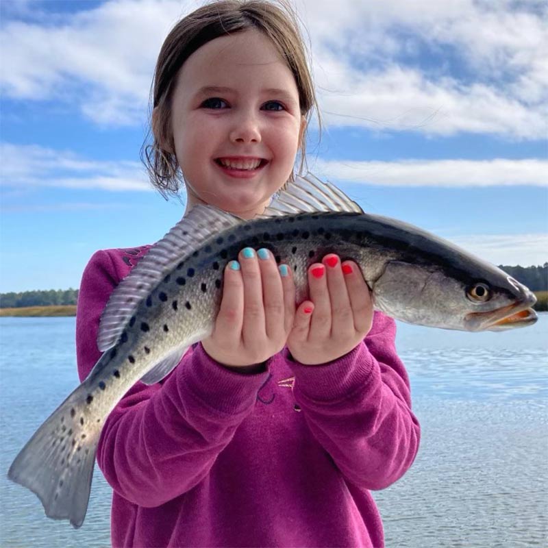 Captain Kai's daughter with a beautiful trout