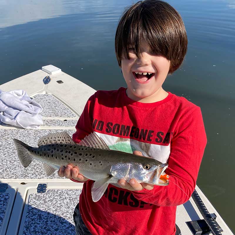 A young angler was happy to catch this trout this week with Captain Kai Williams 