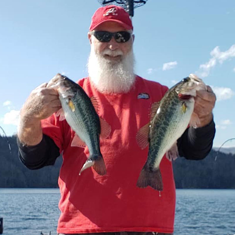 Santa Sam with a couple of bass caught trolling for trout this week