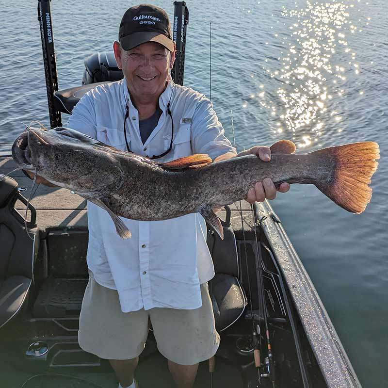 A big flathead caught in 30 feet of water around bass on soft plastics!