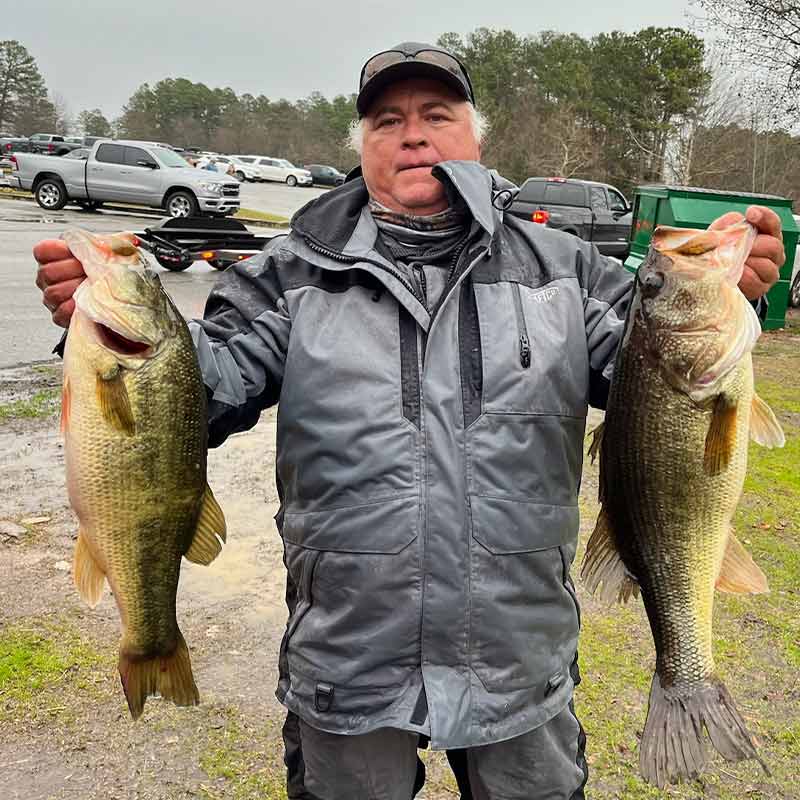 Chris Epting with a couple of pigs he caught Saturday