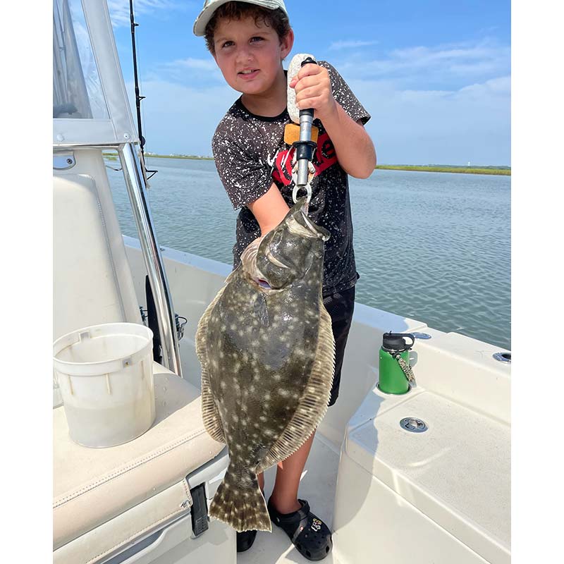 A beautiful flounder caught this week with Captain Smiley 