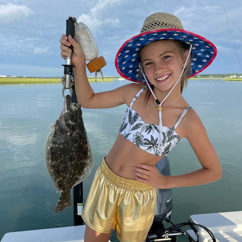 A nice flounder caught with Captain Smiley Fishing Charters this week