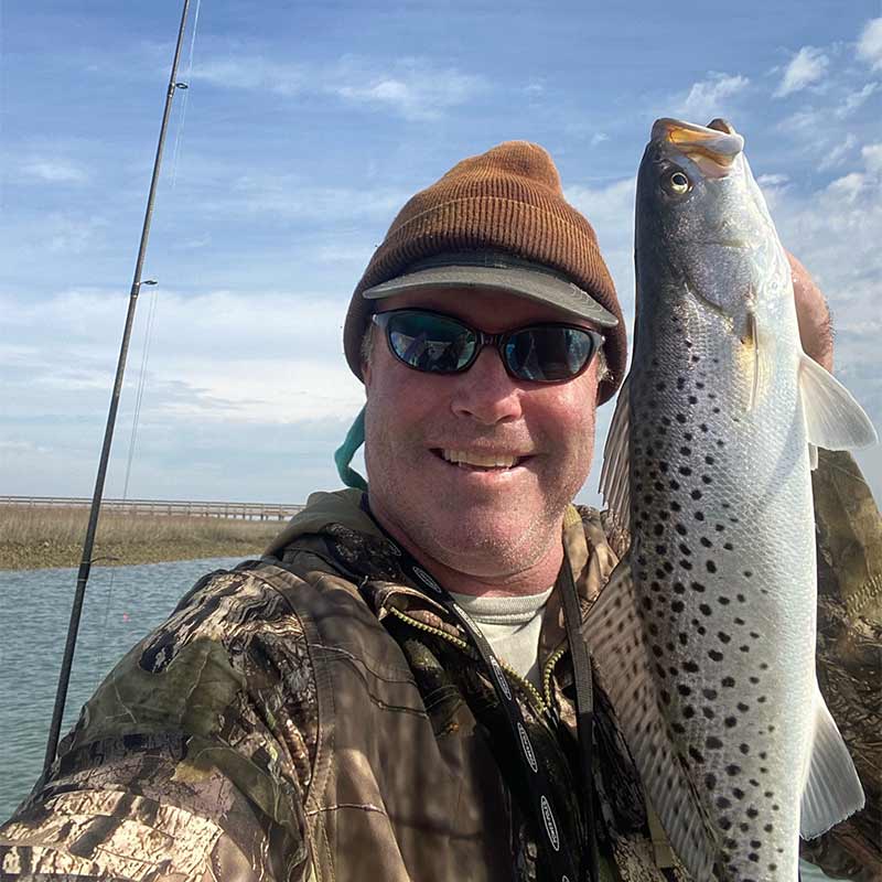 Captain Tom Cushman with a beautiful trout