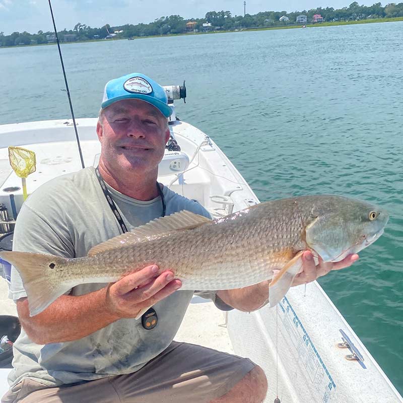 Captain Tom Cushman with a nice summer redfish!