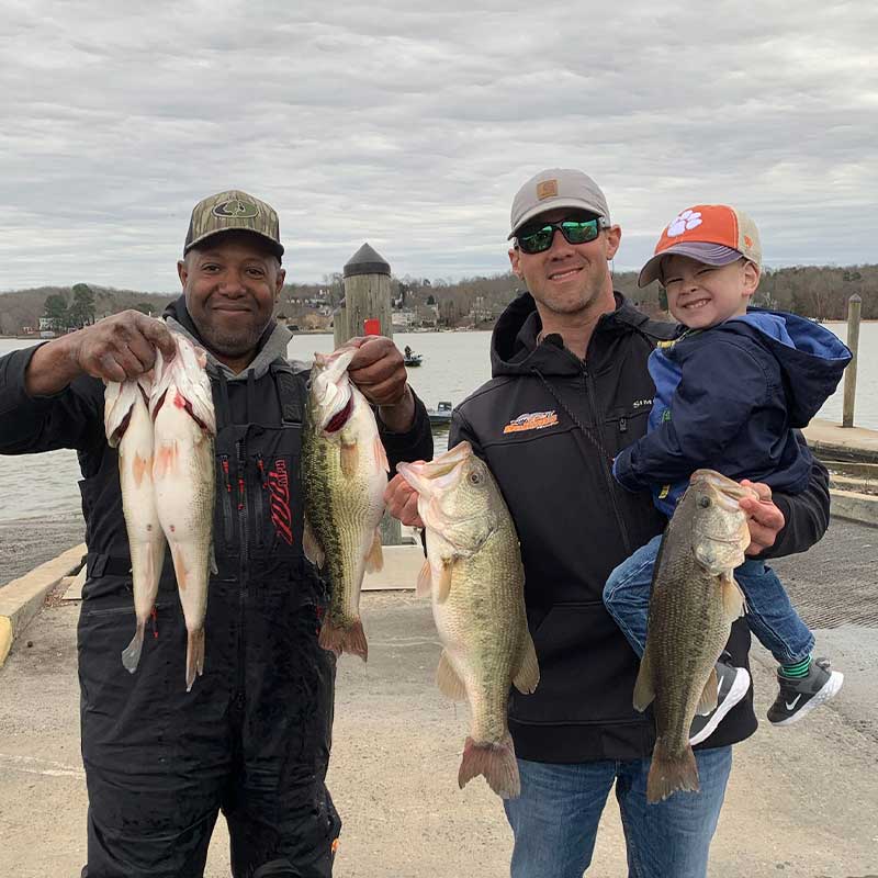 Maurice Barnett, Reid McGinn and son with their big bag