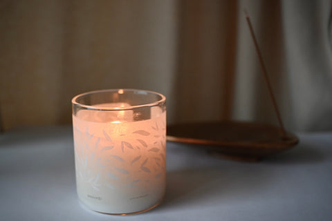 a 200g scented candle in a cozy living room