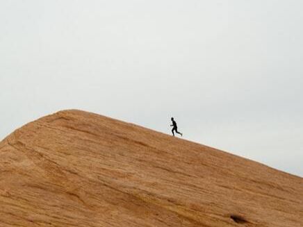 Man running up a hill