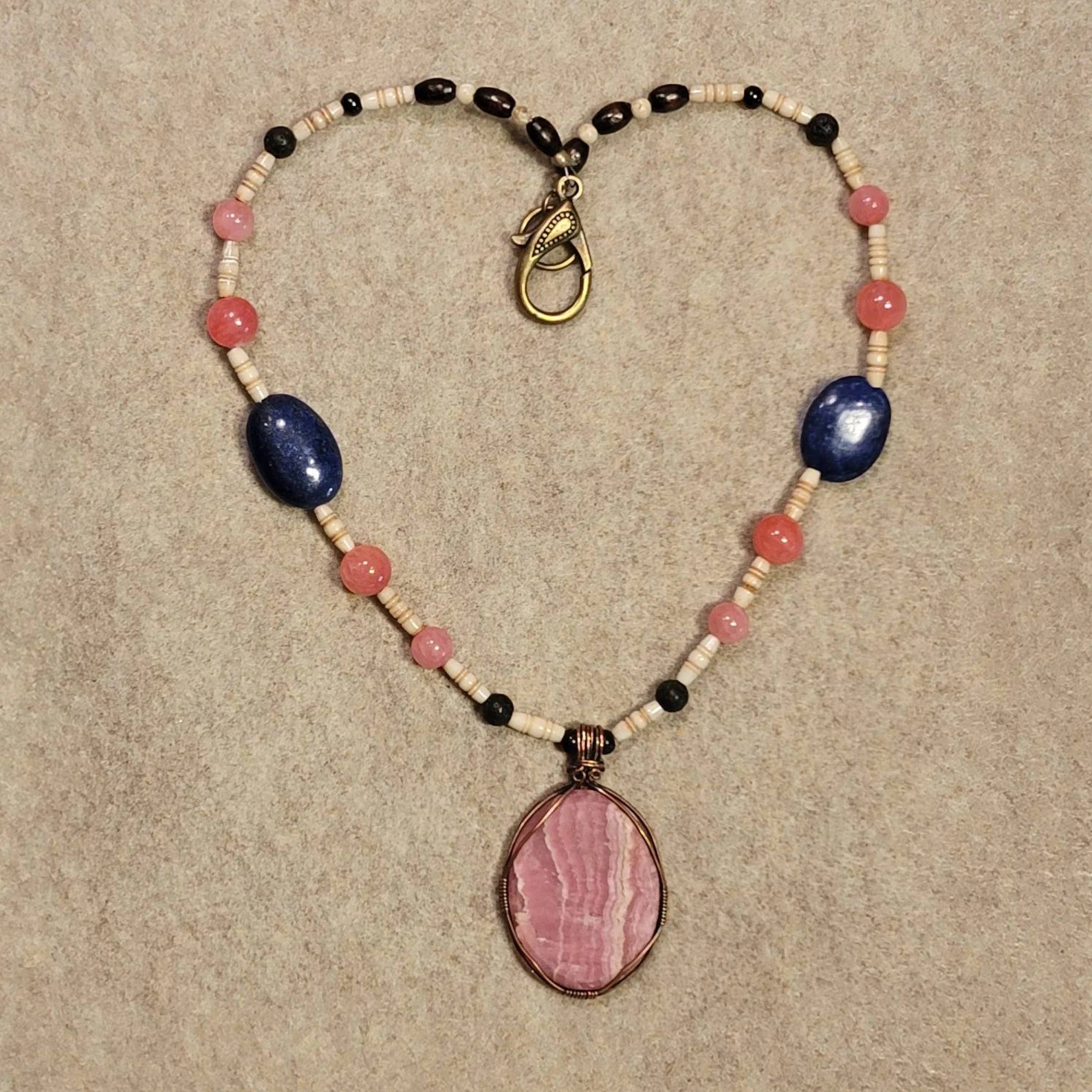 Rhodochrosite Cabochon: Rose Quartz, Lapis Lazuli, Lava and Bone beads