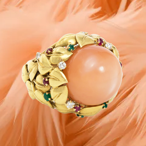 Peach moonstone, diamond, emerald and ruby set in 18-karat gold ring, circa 1950s